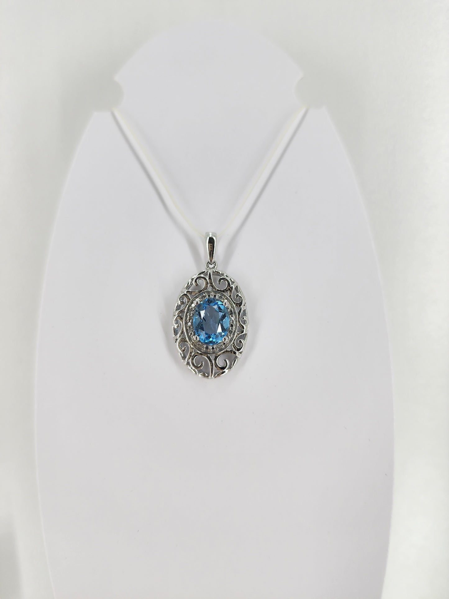 10K white gold blue topaz and diamond pendant 18332