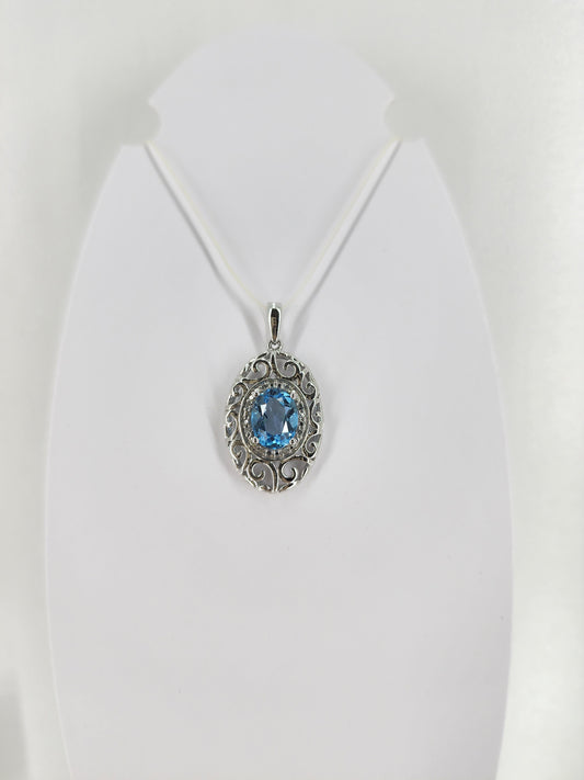 10K white gold blue topaz and diamond pendant  18332