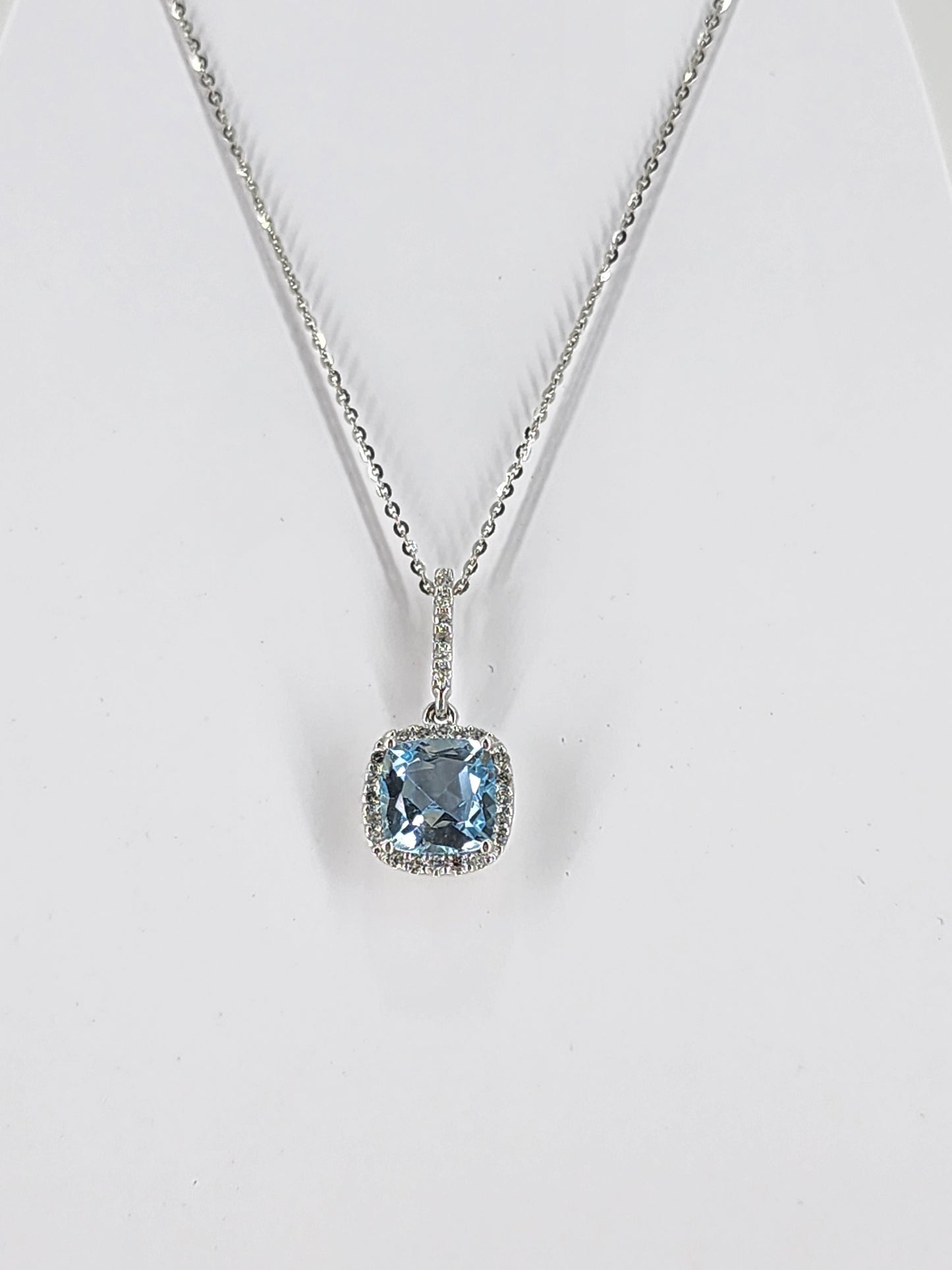 14K white gold sky blue topaz and diamond necklace   18297